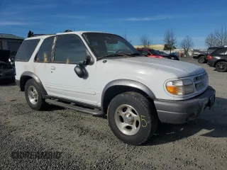 1999 Ford Explorer Sport with VIN 1FMYU24X7XUC50909, listed as a Copart auction lot 50254305 with 83,605 mi miles and Salvage title. Bid and sale history available at DreamBid. Image 4.