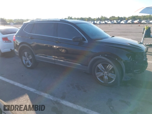 2018 Volkswagen Tiguan SEL Premium with VIN 3VV5B7AX1JM002585, listed as a IAAI auction lot 40495823 with 82,376 mi miles and . Bid and sale history available at DreamBid. Image 14.