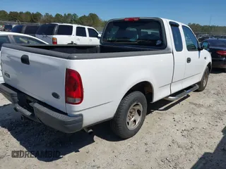 2003 Ford F-150 XL with VIN 1FTRX172X3NA59676, listed as a IAAI auction lot 41821013 with 249,483 mi miles. Bid and sale history available at carsss.com. Image 4.