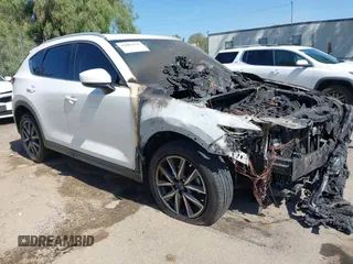 2018 Mazda CX-5 Grand Touring z VIN JM3KFBDM7J0390197, wystawiony jako IAAI lot #42003931 z przebiegiem Nie podano mil oraz . Historia ofert i sprzedaży dostępna na DreamBid. Obrazek 1.