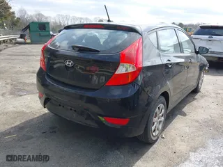 2013 Hyundai Accent GL with VIN KMHCT5AE9DU084356, listed as a IAAI auction lot 41817130 with 114,455 mi miles. Bid and sale history available at carsss.com. Image 4.