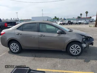 2018 Toyota Corolla L with VIN 5YFBURHE6JP774827, listed as a IAAI auction lot 42598086 with 29,400 mi miles and . Bid and sale history available at DreamBid. Image 13.