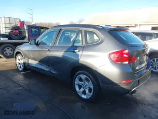 2014 BMW X1 sDrive28i with VIN WBAVM1C52EVW55890, listed as a IAAI auction lot 41512784 with 97,718 mi miles. Bid and sale history available at carsss.com. Image 3.