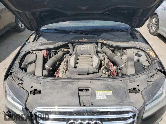 2011 Audi A8 z VIN WAURVAFD9BN005595, wystawiony jako Copart lot #66302644 z przebiegiem 106 610 mil mil oraz Nie do naprawy. Historia ofert i sprzedaży dostępna na DreamBid. Obrazek 11.