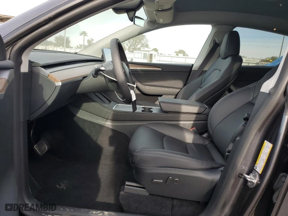 2024 Tesla Model Y with VIN 7SAYGDED7RF114483, listed as a Copart auction lot 89407875 with 7,741 mi miles and Salvage Title. Bid and sale history available at carsss.com. Image 7.
