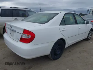 2004 Toyota Camry LE with VIN 4T1BF30K74U073676, listed as a IAAI auction lot 41668460 with 249,847 mi miles. Bid and sale history available at carsss.com. Image 4.