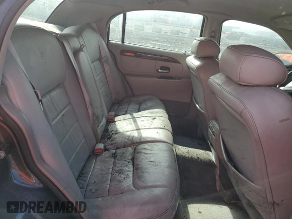 1999 Lincoln Town Car Executive z VIN 1LNHM81W0XY644873, wystawiony jako Copart lot #52865095 z przebiegiem Nie podano mil oraz Szkoda całkowita • Salvage title. Historia ofert i sprzedaży dostępna na DreamBid. Obrazek 10.