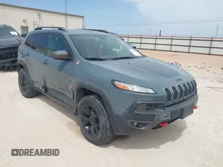 2015 Jeep Cherokee Trailhawk with VIN 1C4PJMBS0FW524479, listed as a IAAI auction lot 41908871 with 118,825 mi miles and . Bid and sale history available at DreamBid. Image 1.