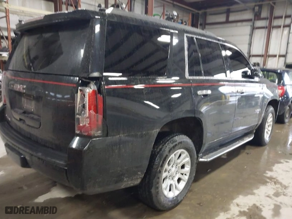 2017 GMC Yukon SLT with VIN 1GKS2BKC0HR147128, listed as a IAAI auction lot 41226119 with 147,557 mi miles. Bid and sale history available at carsss.com. Image 4.