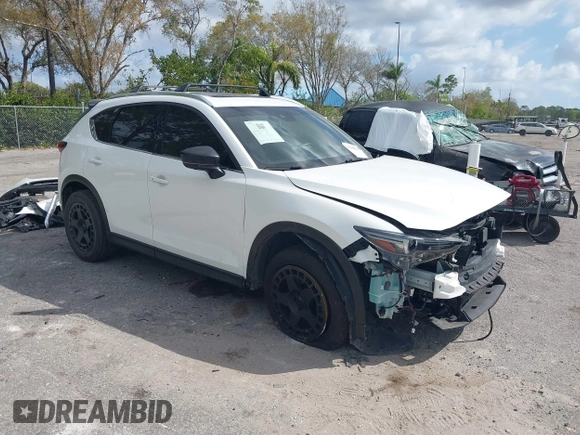 2021 Mazda CX-5 Signature with VIN JM3KFBEY0M0436264, listed as a IAAI auction lot 41568892 with 36,833 mi miles. Bid and sale history available at carsss.com. Image 1.