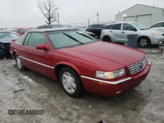 2001 Cadillac Eldorado ESC z VIN 1G6EL12Y61B107519, wystawiony jako Copart lot #38051744 z przebiegiem 52 018 mil mil oraz Czysty tytuł • Clean title. Historia ofert i sprzedaży dostępna na DreamBid. Obrazek 4.