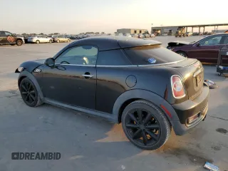 2013 MINI Coupe S z VIN WMWSX3C57DT408719, wystawiony jako Copart lot #75440574 z przebiegiem Nie podano mil oraz Szkody całkowita. Historia ofert i sprzedaży dostępna na DreamBid. Obrazek 2.