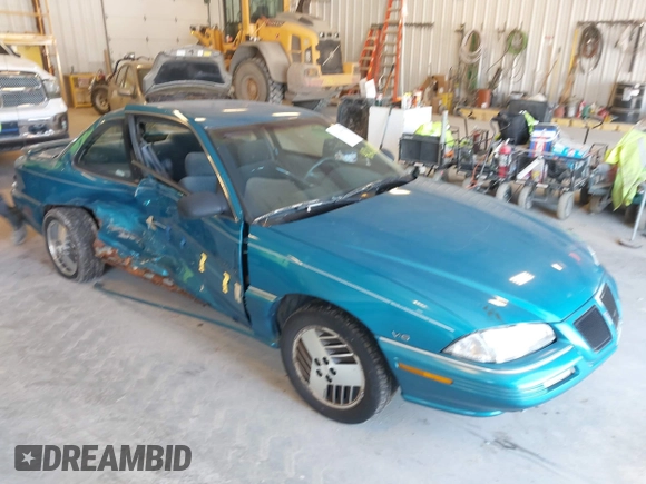 1994 Pontiac Grand Am z VIN 1G2NE15M5RM500643, wystawiony jako IAAI lot #42069901 z przebiegiem 77 129 mil mil oraz . Historia ofert i sprzedaży dostępna na DreamBid. Obrazek 1.