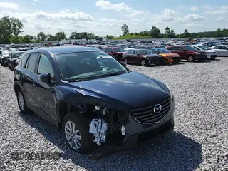 2016 Mazda CX-5 Touring с VIN JM3KE4CY8G0686101, выставлен на аукционе Copart как лот 60361215 с пробегом 126 804 миль миль и На запчасти • Non repairable. История ставок и продаж доступна на DreamBid. Изображение 13.