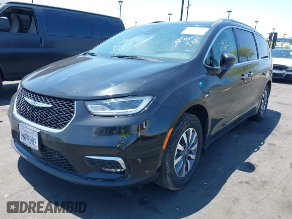 2021 Chrysler Pacifica Hybrid Touring L with VIN 2C4RC1L71MR599631, listed as a IAAI auction lot 42151965 with 67,401 mi miles and . Bid and sale history available at DreamBid. Image 17.