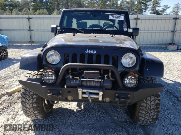 2007 Jeep Wrangler Unlimited Sahara with VIN 1J4GA59197L141821, listed as a Copart auction lot 76897044 with 124,070 mi miles and Salvage title. Bid and sale history available at DreamBid. Image 5.
