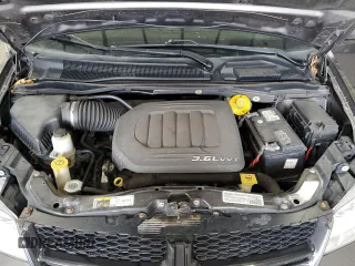2014 Dodge Grand Caravan SE with VIN 2C4RDGBG6ER463529, listed as a Copart auction lot 51830695 with 105,675 mi miles and Salvage Title. Bid and sale history available at DreamBid. Image 12.