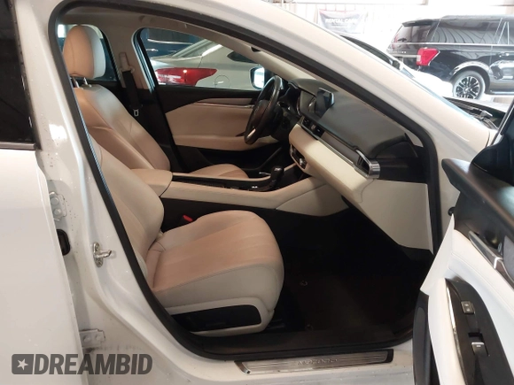 2021 Mazda 6 Carbon Edition with VIN JM1GL1WY9M1614117, listed as a IAAI auction lot 41305576 with 54,670 mi miles and . Bid and sale history available at DreamBid. Image 5.