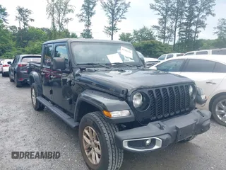 2023 Jeep Gladiator Sport S with VIN 1C6HJTAG3PL521954, listed as a IAAI auction lot 42502126 with 49,606 mi miles and . Bid and sale history available at DreamBid. Image 1.