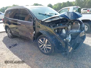 2017 Honda Pilot Touring with VIN 5FNYF5H91HB038268, listed as a IAAI auction lot 42786448 with 62,195 mi miles and . Bid and sale history available at DreamBid. Image 1.