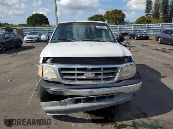 2000 Ford F-150 XL with VIN 1FTRX17W2YNB05575, listed as a Copart auction lot 86606934 with 0 mi miles and Salvage Title. Bid and sale history available at carsss.com. Image 5.