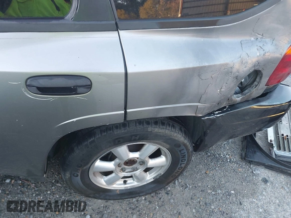 2005 GMC Envoy SLE with VIN 1GKDS13S352215032, listed as a IAAI auction lot 41221612 with 260,647 mi miles and . Bid and sale history available at DreamBid. Image 6.
