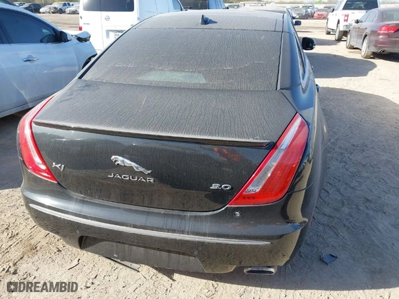 2015 Jaguar XJ with VIN SAJWA1CZ1F8V90549, listed as a IAAI auction lot 41817327 with NaN miles. Bid and sale history available at carsss.com. Image 16.