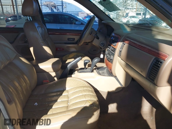 1999 Jeep Grand Cherokee Limited with VIN 1J4GW68NXXC727844, listed as a IAAI auction lot 41290773 with 222,838 mi miles. Bid and sale history available at carsss.com. Image 5.