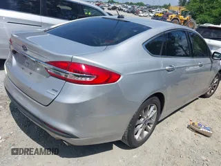 2017 Ford Fusion SE z VIN 3FA6P0HDXHR238713, wystawiony jako IAAI lot #42304140 z przebiegiem 157 630 mil mil oraz . Historia ofert i sprzedaży dostępna na DreamBid. Obrazek 4.