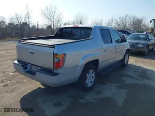 2006 Honda Ridgeline RTL with VIN 2HJYK16576H555999, listed as a IAAI auction lot 42023875 with 202,128 mi miles. Bid and sale history available at carsss.com. Image 4.