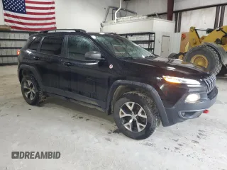 2016 Jeep Cherokee Trailhawk with VIN 1C4PJMBS7GW337774, listed as a Copart auction lot 55184885 with 161,567 mi miles and Salvage title. Bid and sale history available at DreamBid. Image 4.