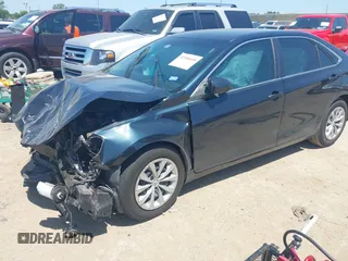 2016 Toyota Camry XLE with VIN 4T4BF1FK3GR535768, listed as a IAAI auction lot 41988698 with 157,452 mi miles. Bid and sale history available at carsss.com. Image 2.