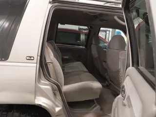 1999 GMC Yukon with VIN 1GKEK13R7XJ723255, listed as a IAAI auction lot 41879617 with 148,324 mi miles. Bid and sale history available at carsss.com. Image 8.