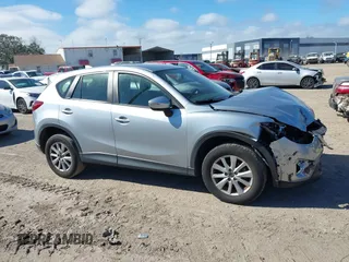 2016 Mazda CX-5 Sport with VIN JM3KE2BE9G0915168, listed as a IAAI auction lot 41482749 with 86,802 mi miles and . Bid and sale history available at carsss.com. Image 13.