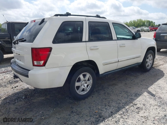 2010 Jeep Grand Cherokee Laredo with VIN 1J4PR4GK0AC151711, listed as a IAAI auction lot 41940295 with 185,684 mi miles. Bid and sale history available at carsss.com. Image 4.