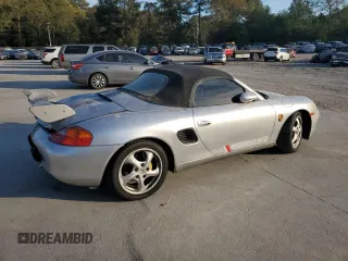 1998 Porsche Boxster с VIN WP0CA2987WS620369, выставлен на аукционе Copart как лот 81003964 с пробегом Не указан миль и Списание • Salvage title. История ставок и продаж доступна на DreamBid. Изображение 3.