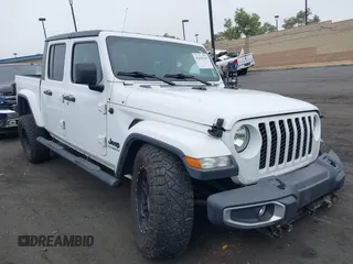 2020 Jeep Gladiator Sport S with VIN 1C6HJTAG9LL194454, listed as a IAAI auction lot 42430339 with 90,461 mi miles and . Bid and sale history available at DreamBid. Image 1.