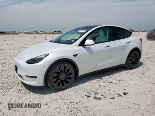2022 Tesla Model Y Performance z VIN 7SAYGDEF1NF438640, wystawiony jako Copart lot #56849115 z przebiegiem 22 983 mil mil oraz Czysty tytuł • Clean title. Historia ofert i sprzedaży dostępna na DreamBid. Obrazek 1.