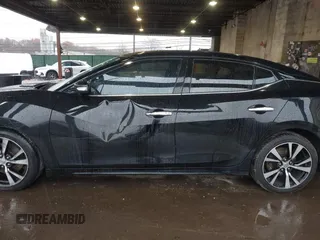 2017 Nissan Maxima SV z VIN 1N4AA6AP1HC447467, wystawiony jako IAAI lot #40918468 z przebiegiem 166 352 mil mil oraz . Historia ofert i sprzedaży dostępna na DreamBid. Obrazek 14.