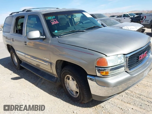 2003 GMC Yukon SLT with VIN 1GKEC13V33R298333, listed as a IAAI auction lot 41582447 with 166,047 mi miles. Bid and sale history available at carsss.com. Image 1.