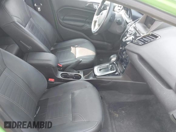 2014 Ford Fiesta Titanium z VIN 3FADP4FJXEM226724, wystawiony jako IAAI lot #42427106 z przebiegiem 63 302 mil mil oraz . Historia ofert i sprzedaży dostępna na DreamBid. Obrazek 5.
