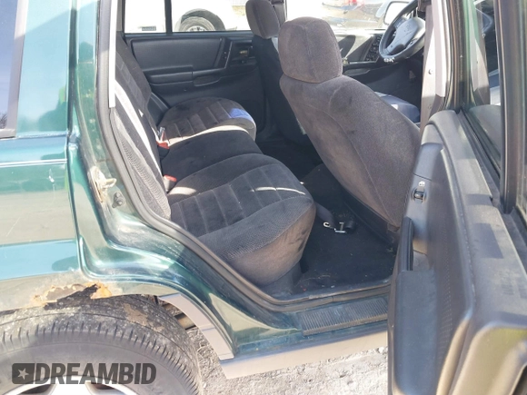 1997 Jeep Grand Cherokee Laredo with VIN 1J4GZ58S2VC595442, listed as a IAAI auction lot 41772133 with 229,764 mi miles. Bid and sale history available at carsss.com. Image 8.