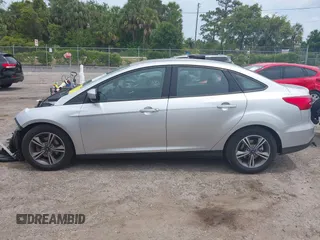 2018 Ford Focus SE z VIN 1FADP3FE4JL214013, wystawiony jako IAAI lot #42180138 z przebiegiem 72 550 mil mil oraz . Historia ofert i sprzedaży dostępna na DreamBid. Obrazek 14.