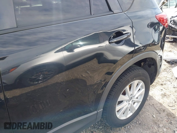 2014 Mazda CX-5 Touring with VIN JM3KE2CY9E0333951, listed as a IAAI auction lot 41825345 with 124,684 mi miles. Bid and sale history available at carsss.com. Image 17.