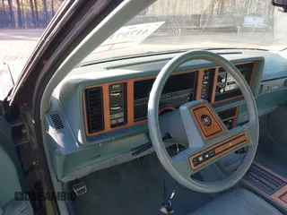 1986 Cadillac Seville z VIN 1G6KS6988GU804079, wystawiony jako IAAI lot #41757149 z przebiegiem 48 807 mil mil oraz . Historia ofert i sprzedaży dostępna na DreamBid. Obrazek 7.