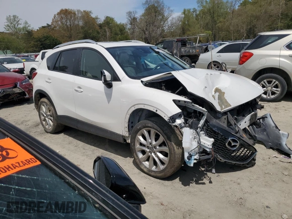 2015 Mazda CX-5 Grand Touring with VIN JM3KE4DY0F0458719, listed as a Copart auction lot 52960365 with 128,372 mi miles and Salvage Title. Bid and sale history available at DreamBid. Image 4.