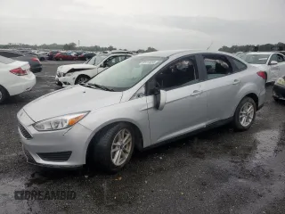 2018 Ford Focus SE with VIN 1FADP3F24JL272919, listed as a Copart auction lot 63114855 with 97,393 mi miles and Salvage title. Bid and sale history available at DreamBid. Image 1.