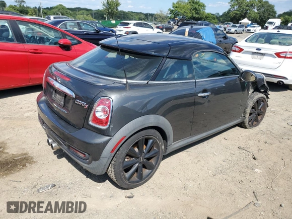 2015 MINI Coupe S z VIN WMWSX3C55FT409449, wystawiony jako Copart lot #66574174 z przebiegiem 99 155 mil mil oraz Szkody całkowita. Historia ofert i sprzedaży dostępna na DreamBid. Obrazek 3.
