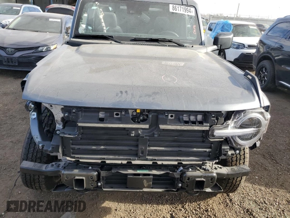 2024 Ford Bronco Big Bend z VIN 1FMDE7BH9RLA85832, wystawiony jako Copart lot #86171994 z przebiegiem 1 196 mil mil oraz Szkoda całkowita • Salvage title. Historia ofert i sprzedaży dostępna na DreamBid. Obrazek 5.