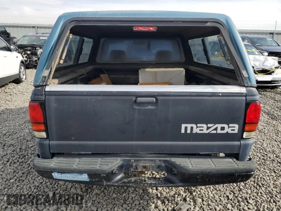 1994 Mazda B-Series Truck z VIN 4F4CR12AXRTM29986, wystawiony jako Copart lot #78825554 z przebiegiem 183 595 mil mil oraz Szkoda całkowita • Salvage title. Historia ofert i sprzedaży dostępna na DreamBid. Obrazek 6.
